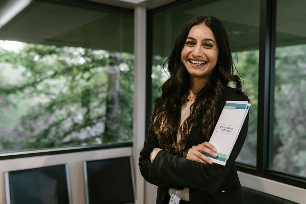 the happy woman in the office outfit